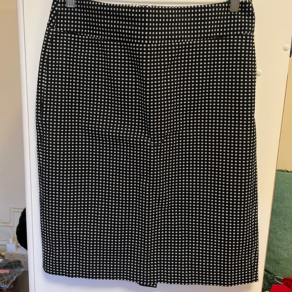 A-line Black skirt with cream dots.